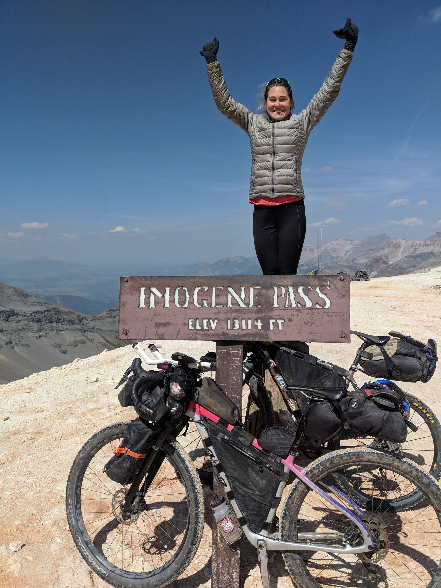 Caitlin in her victory pose on Imogene Pass